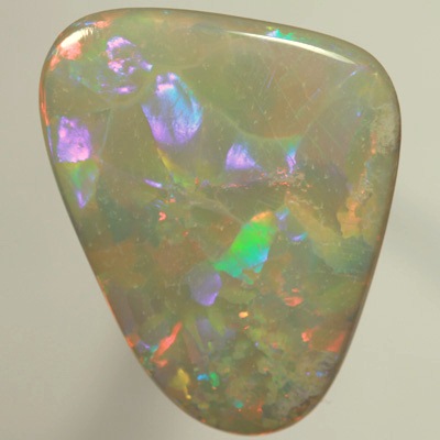 SOLID SEMI BLACK OPAL  Huge opal. Very bright fire, Flagstone Harlequin pattern. Top quality. SEE VIDEO